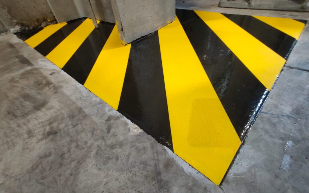 Naprawa dylatacji i oznakowanie stref niebezpiecznych w hali produkcyjnej